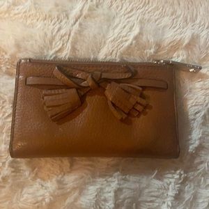 Kate Spade brown leather wallet with red interior